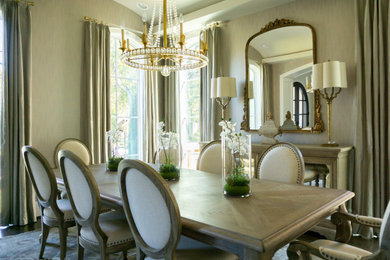 Example of a large transitional vaulted ceiling and wallpaper dining room design in Houston