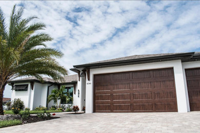 Example of a classic white exterior home design in Miami