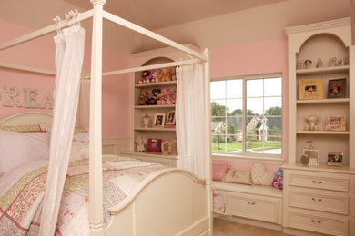 Mid-sized elegant girl carpeted kids' room photo in Houston with pink walls