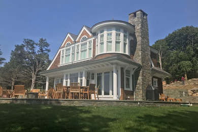 Traditional two-story wood exterior home idea in Providence with a shingle roof