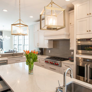 Photo of a mid-sized eclectic galley kitchen pantry in Denver with an undermount sink, shaker cabinets, turquoise cabinets, quartz benchtops, grey splashback, ceramic splashback, stainless steel appliances, light hardwood floors, with island, brown floor and white benchtop.