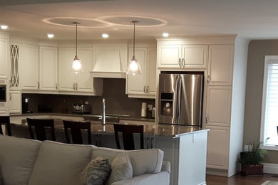 This is an example of a large transitional eat-in kitchen in Other.