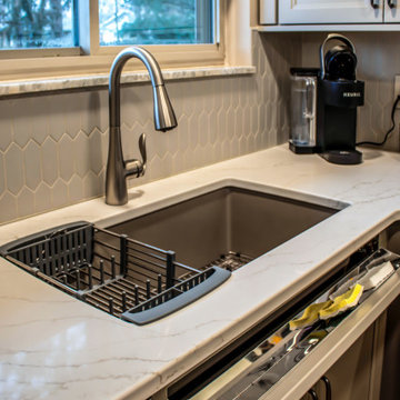 Two-Tone Neutral Kitchen with Quartz Countertop and Soho Picket Backsplash