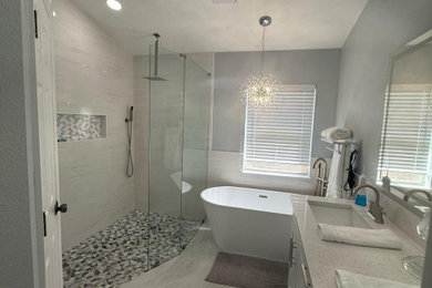 Example of a large trendy master white tile and ceramic tile ceramic tile, white floor and double-sink bathroom design in Tampa with shaker cabinets, white cabinets, a one-piece toilet, gray walls, a drop-in sink, quartzite countertops, white countertops, a niche and a built-in vanity