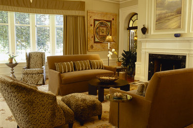 Large eclectic formal and enclosed medium tone wood floor and brown floor living room photo in New York with beige walls, a standard fireplace, a wood fireplace surround and no tv