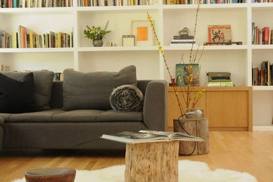 This is an example of a mid-sized scandinavian open concept living room in Los Angeles with light hardwood floors.
