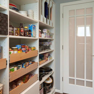 Inspiration for a large arts and crafts galley kitchen pantry in Seattle with shaker cabinets, white cabinets, quartz benchtops, white splashback, dark hardwood floors and with island.