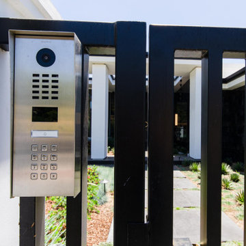 Modern steel gates and Full View Frameless glass garage door