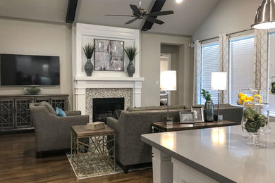 Example of a mid-sized minimalist open concept brown floor living room design in Dallas with gray walls, a tile fireplace and a wall-mounted tv
