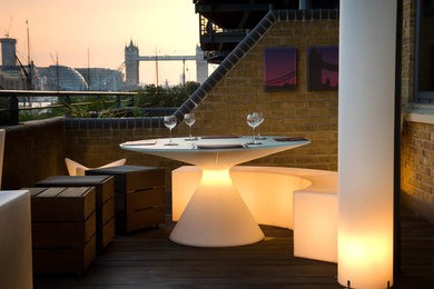 Photo of a small contemporary roof garden in London with decking.