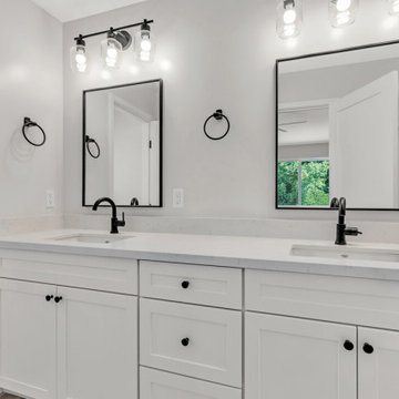 Dual Vanity Bathroom with White Quartz and Black Accent