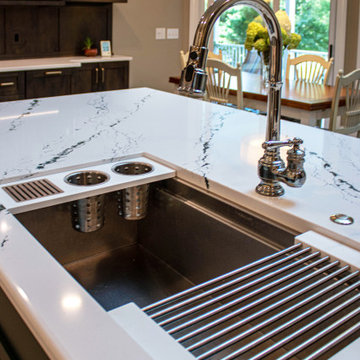3 Finishes on Kitchen Cabinetry with Galley Workstation in Island and Wine Bar