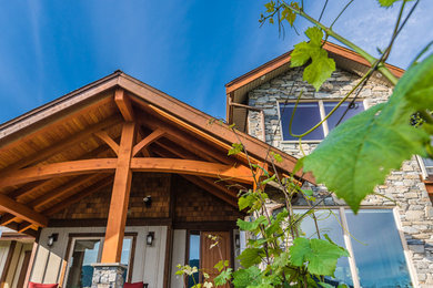 Inspiration for a transitional mixed siding exterior home remodel