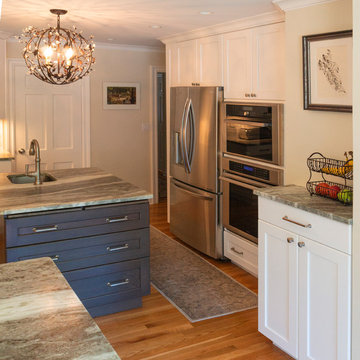 View of new expanded space and island with appliance wall.
