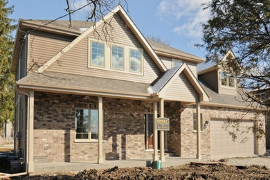 Example of an arts and crafts exterior home design in Chicago