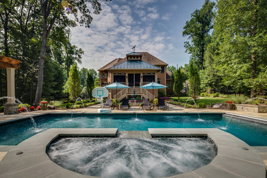 Inspiration for a timeless backyard custom-shaped pool remodel in DC Metro