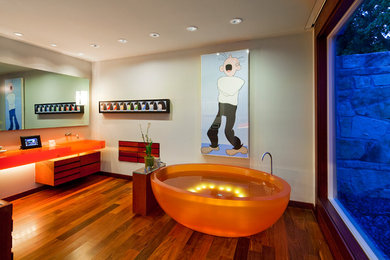 Freestanding bathtub - large eclectic master dark wood floor and brown floor freestanding bathtub idea in Austin with beige walls, a trough sink and orange countertops