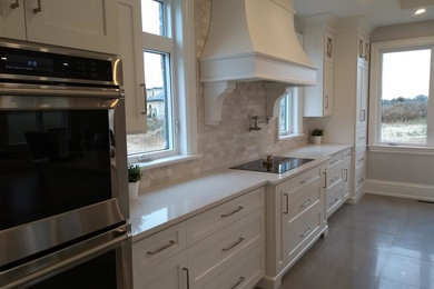 Example of a transitional kitchen design in Toronto