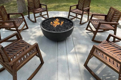 Inspiration for a mid-sized timeless backyard concrete patio remodel in Denver with a fire pit and no cover