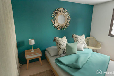 マルセイユにある中くらいな北欧スタイルのおしゃれな主寝室 (青い壁、ラミネートの床、暖炉なし、茶色い床) のインテリア