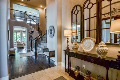 Mid-sized transitional foyer in Dallas with beige walls, travertine floors and beige floor.