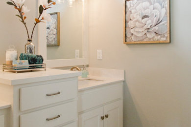 Large modern master bathroom in Kansas City with recessed-panel cabinets, white cabinets, grey walls, an undermount sink, engineered quartz benchtops, white benchtops, an enclosed toilet, a double vanity and a built-in vanity.