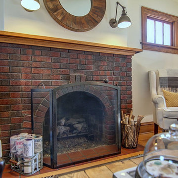Close-up of home's original brick fireplace with ceramic tile hearth.