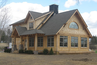 Mid-sized arts and crafts two-storey exterior in New York with wood siding.