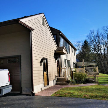 Installing Khaki Brown Fiber Cement Cedarmill Planks on Home in Media, PA