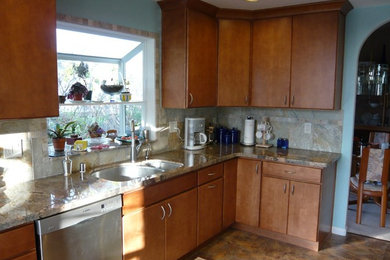 Kitchen - transitional l-shaped kitchen idea in Sacramento with flat-panel cabinets, medium tone wood cabinets, granite countertops, beige backsplash, stainless steel appliances and no island