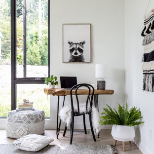 Inspiration for a small scandi study in Vancouver with white walls, light hardwood flooring and a freestanding desk.