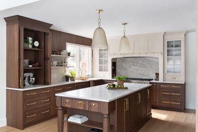 Eat-in kitchen - large transitional u-shaped brown floor and medium tone wood floor eat-in kitchen idea in DC Metro with an undermount sink, shaker cabinets, quartzite countertops, an island, beige countertops, dark wood cabinets, beige backsplash, stone slab backsplash and paneled appliances