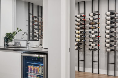 Small trendy wine cellar photo in Calgary