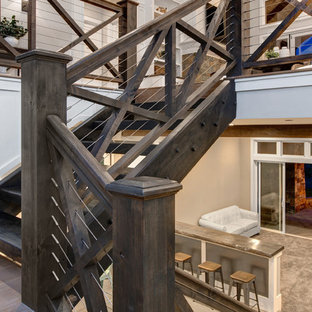 Design ideas for a large country look-out basement in Salt Lake City with white walls and concrete flooring.