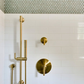 Modern Shower with Brass Fixtures and Penny Tile Accent
