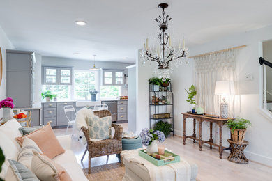 Mid-sized transitional formal and enclosed light wood floor and beige floor living room photo in Other with white walls, no fireplace and no tv