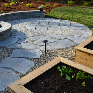 Mid-sized eclectic backyard patio in Richmond with a vegetable garden, concrete pavers and no cover.