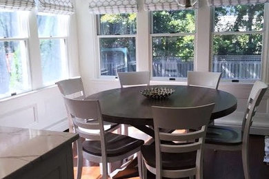 Inspiration for a small transitional dark wood floor and brown floor kitchen/dining room combo remodel in New York with white walls