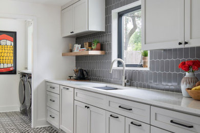 Inspiration for a transitional laundry room remodel in Austin