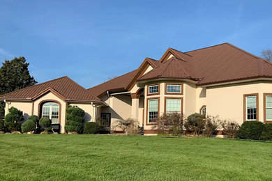 Inspiration for an exterior home remodel in Other with a metal roof