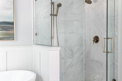 Transitional master gray tile and marble tile marble floor, double-sink, white floor and wainscoting bathroom photo in Charlotte with shaker cabinets, blue cabinets, an undermount sink, marble countertops, a hinged shower door, a built-in vanity and white countertops