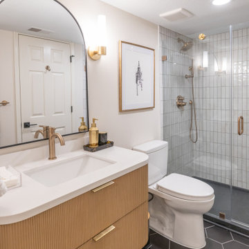 Warm & Inviting Basement Retreat with Custom Bar + Entertainment Center