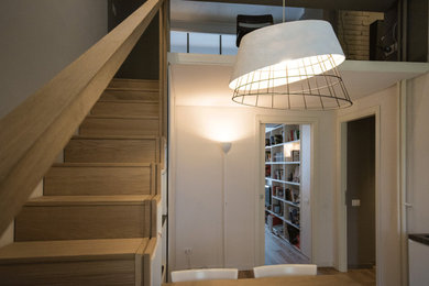 Photo of a small modern wood straight staircase in Sydney with wood risers, wood railing and brick walls.
