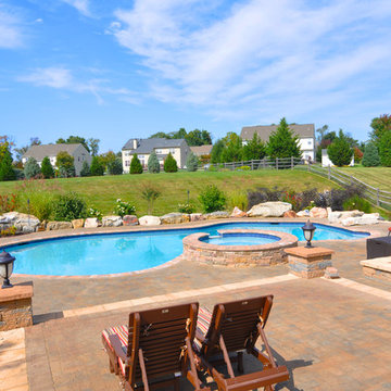 Beautiful Mountain Lake style in-ground pool with raised spa