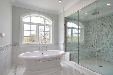Inspiration for a large transitional master white tile and mosaic tile marble floor freestanding bathtub remodel in Orange County with gray walls