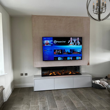 Media Wall Featuring Electric Fire and Cabinetry
