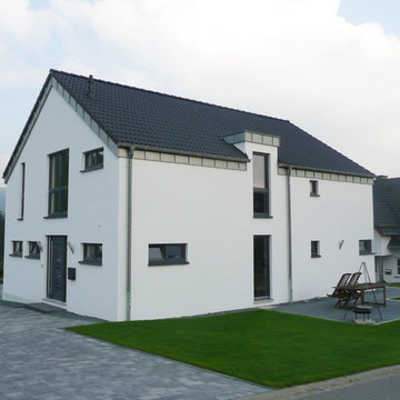 Haus Nölke - Einfamilienholzhaus mit hellem Putz und Satteldach