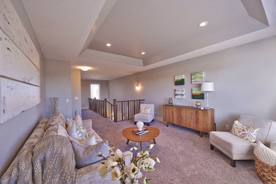 Photo of a mid-sized transitional open concept family room in Calgary with beige walls and carpet.