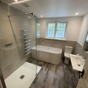 Corner bath with a walk-in shower suit this family bathroom perfectly