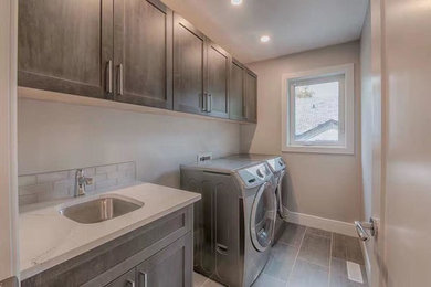 Inspiration for a modern laundry room in Calgary.